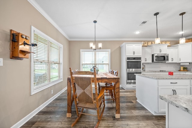 kitchen with ornamental molding, an inviting chandelier, visible vents, white cabinets, and appliances with stainless steel finishes