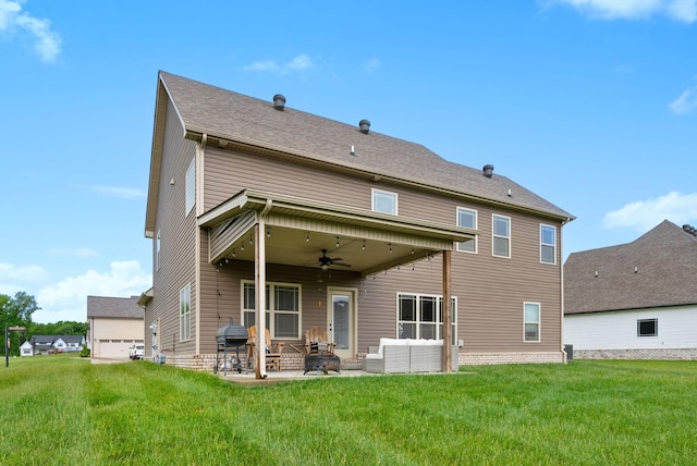 rear view of house featuring a lawn, a patio, ceiling fan, and outdoor lounge area