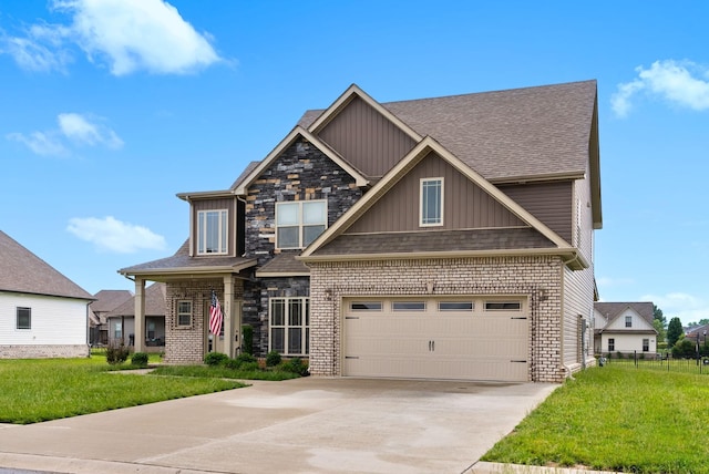 craftsman-style house featuring a front yard, board and batten siding, driveway, and a garage