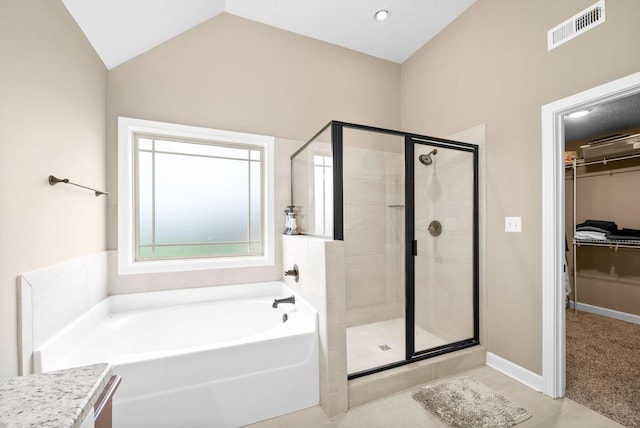 full bathroom with a stall shower, tile patterned flooring, a garden tub, and visible vents