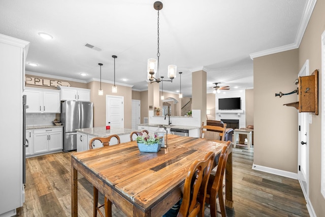dining area with visible vents, wood finished floors, recessed lighting, and ceiling fan with notable chandelier