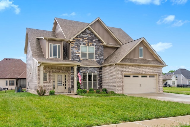 craftsman-style home with concrete driveway, a front yard, cooling unit, and board and batten siding