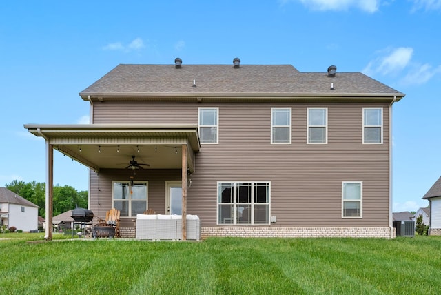 rear view of property featuring a patio, a ceiling fan, central air condition unit, an outdoor hangout area, and a yard