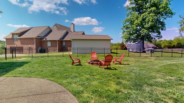 view of yard featuring a fenced backyard and an outdoor fire pit