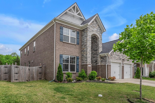 traditional-style home with concrete driveway, brick siding, an attached garage, and a gate