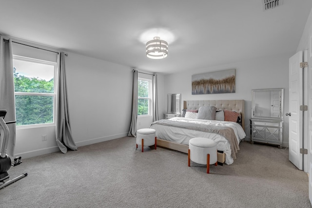 carpeted bedroom with baseboards