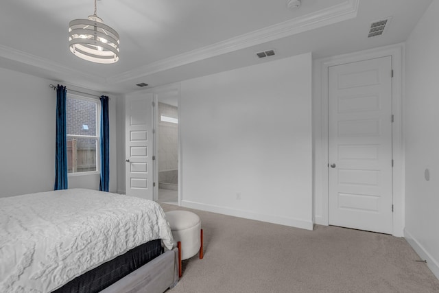 carpeted bedroom featuring a raised ceiling, a chandelier, crown molding, baseboards, and ensuite bathroom