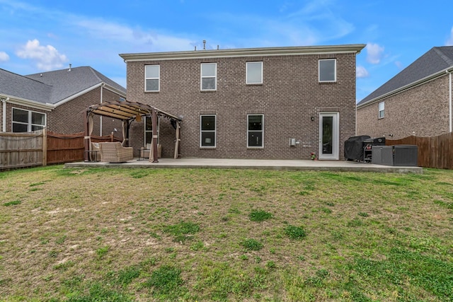 back of house with a pergola, a patio, brick siding, and cooling unit