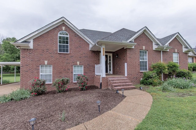 5012 John Hagar Rd, Hermitage, TN 37076 - view of front of house with brick siding, roof with shingles, and a front yard
