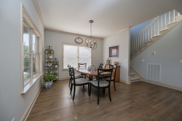 dining room featuring a chandelier, stairs, ornamental molding, wood finished floors, and baseboards