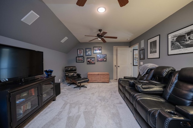 living area with a ceiling fan, carpet floors, and lofted ceiling