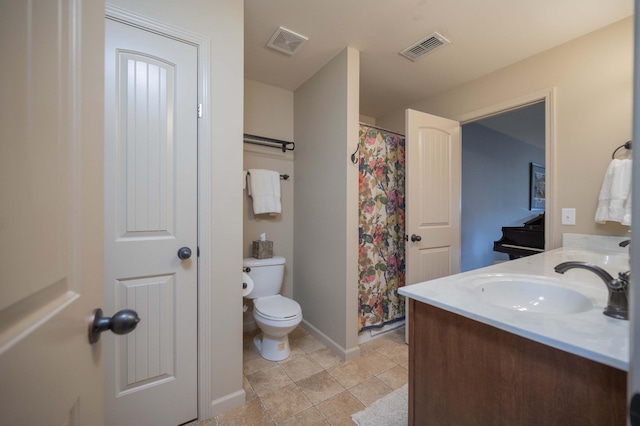 bathroom with toilet, baseboards, curtained shower, tile patterned flooring, and double vanity