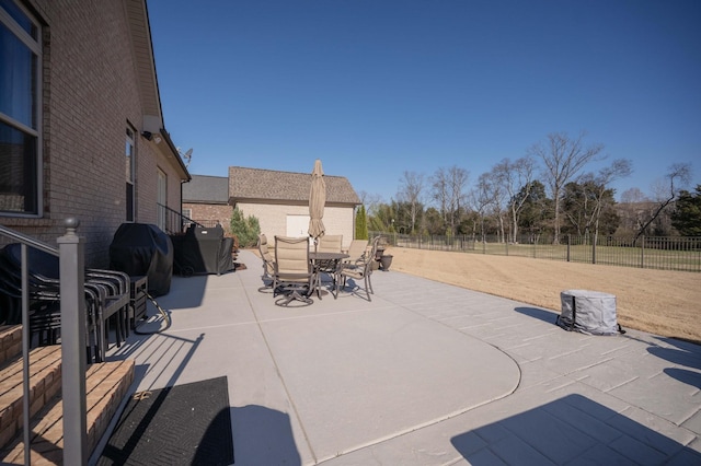 view of patio / terrace with outdoor dining area, fence, and grilling area