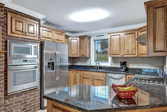 121 Grassland Dr, Gallatin, TN 37066 - kitchen featuring stainless steel appliances, a sink, crown molding, tasteful backsplash, and dark stone countertops
