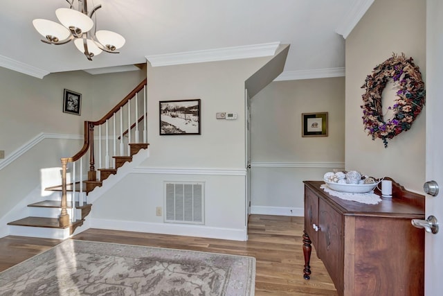 121 Grassland Dr, Gallatin, TN 37066 - stairs with a chandelier, wood finished floors, baseboards, and crown molding