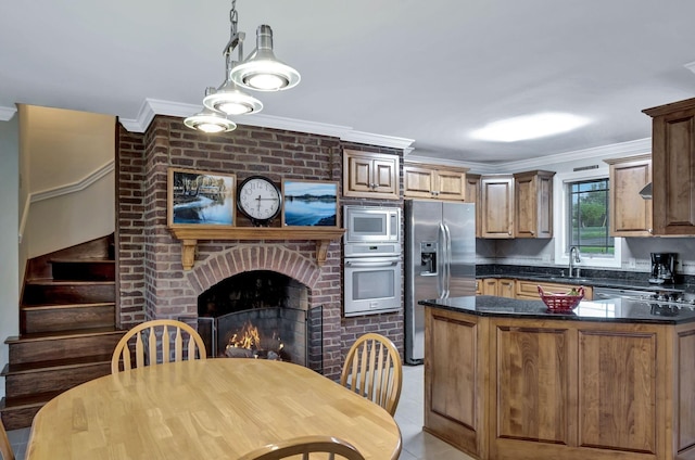 121 Grassland Dr, Gallatin, TN 37066 - kitchen with appliances with stainless steel finishes, ornamental molding, a sink, pendant lighting, and light tile patterned floors