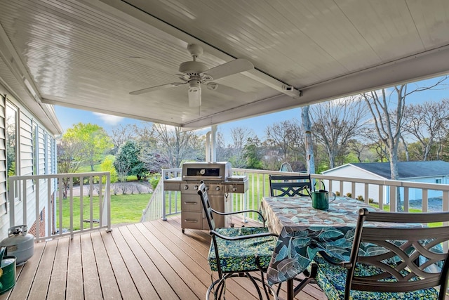 121 Grassland Dr, Gallatin, TN 37066 - wooden terrace featuring a yard, a ceiling fan, outdoor dining space, and area for grilling