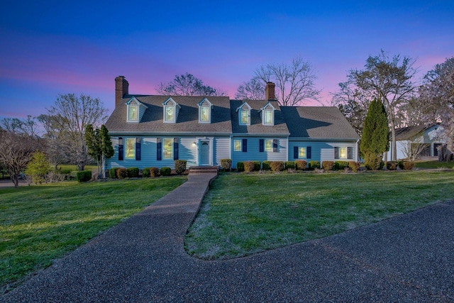 121 Grassland Dr, Gallatin, TN 37066 - cape cod house featuring a chimney and a front lawn