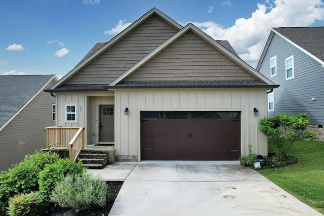 view of front of property featuring an attached garage, driveway, and board and batten siding