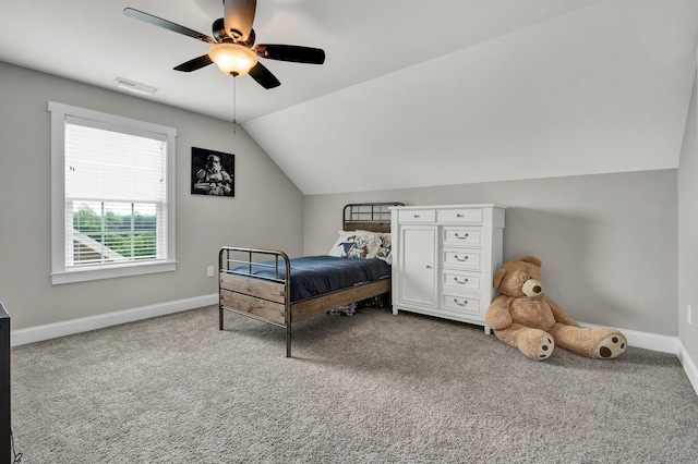 carpeted bedroom featuring baseboards, lofted ceiling, and ceiling fan