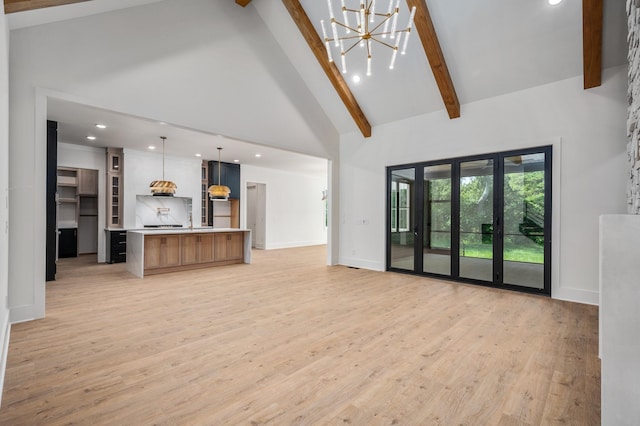 unfurnished living room with high vaulted ceiling, beam ceiling, light wood-type flooring, recessed lighting, and baseboards