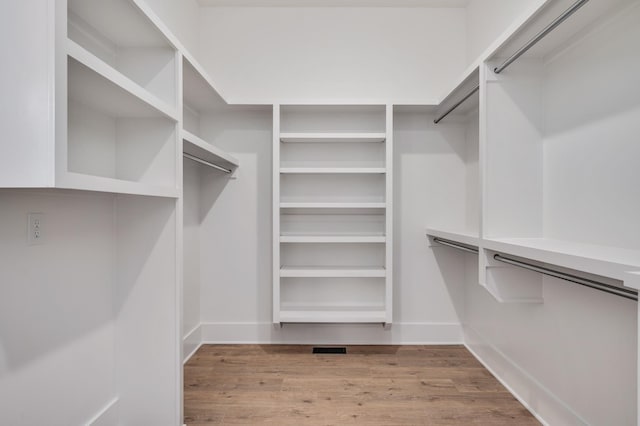 spacious closet featuring light wood-type flooring