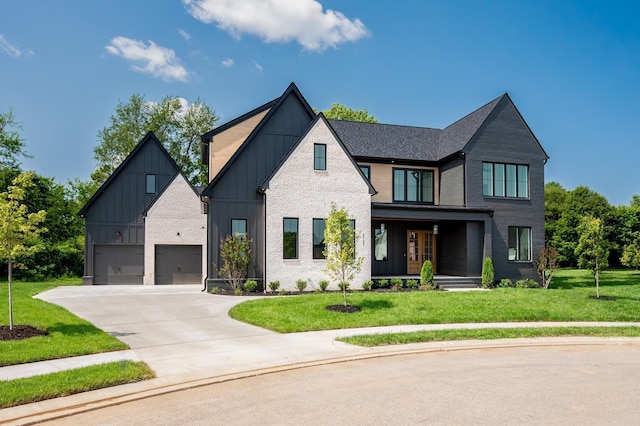modern farmhouse style home with board and batten siding, concrete driveway, a front lawn, a porch, and brick siding