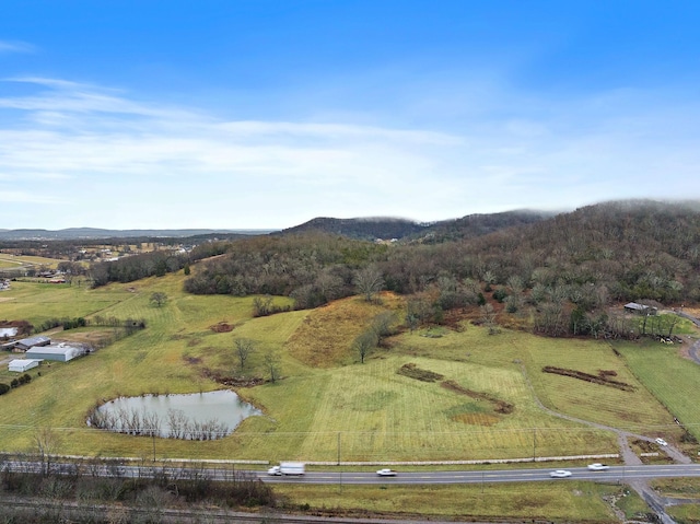 view of property location with a water and mountain view and rural landscape
