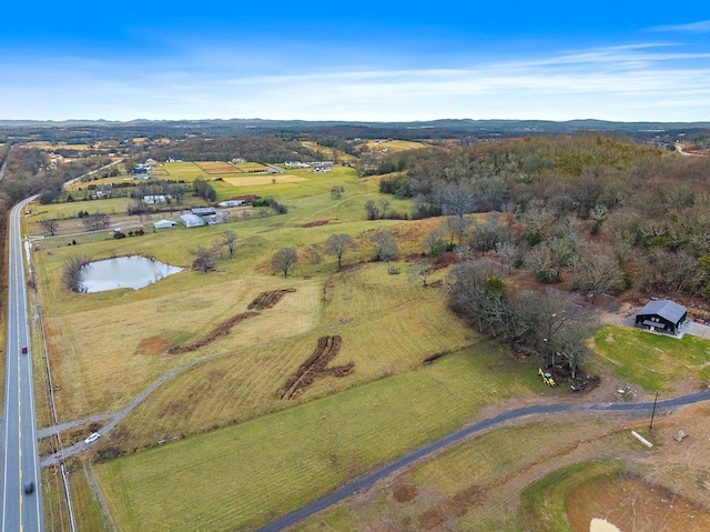 aerial overview of property's location featuring rural landscape and a nearby body of water