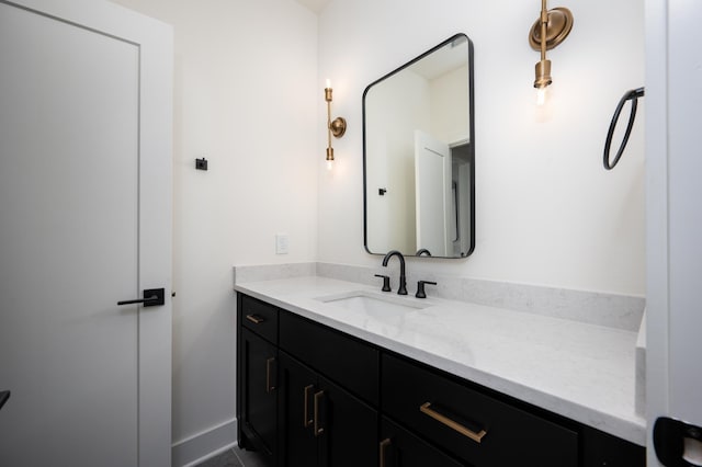 bathroom featuring vanity and baseboards