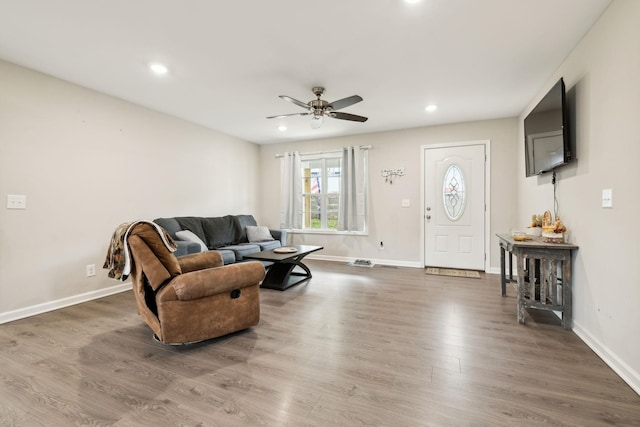 living room featuring a ceiling fan, wood finished floors, recessed lighting, and baseboards