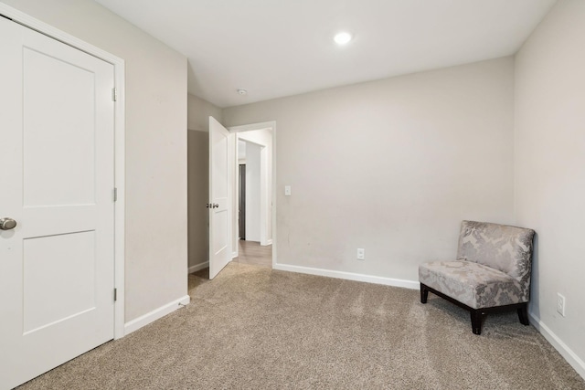 living area featuring carpet floors, baseboards, and recessed lighting