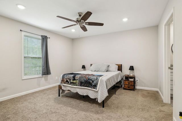 carpeted bedroom featuring baseboards, recessed lighting, and a ceiling fan