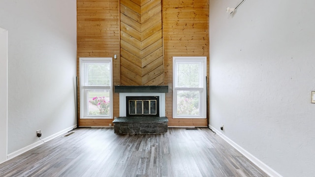5900 New Hope Ct, Hermitage, TN 37076 - living area with baseboards, plenty of natural light, wood finished floors, and wooden walls