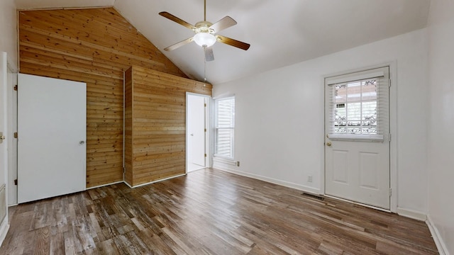 5900 New Hope Ct, Hermitage, TN 37076 - unfurnished bedroom with high vaulted ceiling, wood walls, wood finished floors, baseboards, and a ceiling fan