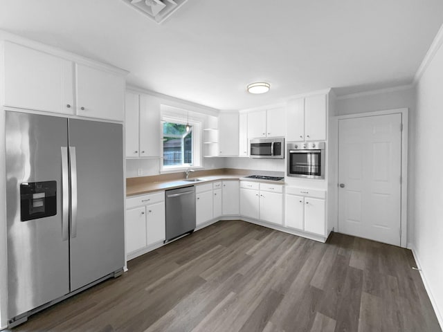 kitchen featuring appliances with stainless steel finishes, dark wood-style flooring, white cabinets, light countertops, and open shelves