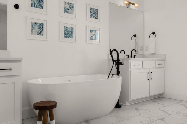 5615 Tennessee Ave Unit A, Nashville, TN 37209 - full bathroom featuring marble look tiles, vanity, a soaking tub, and baseboards