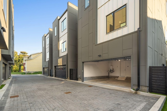1400 Arthur Ave Unit 3, Nashville, TN 37208 - view of building exterior featuring a garage and decorative driveway