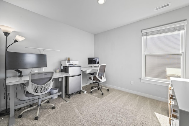 carpeted office with baseboards