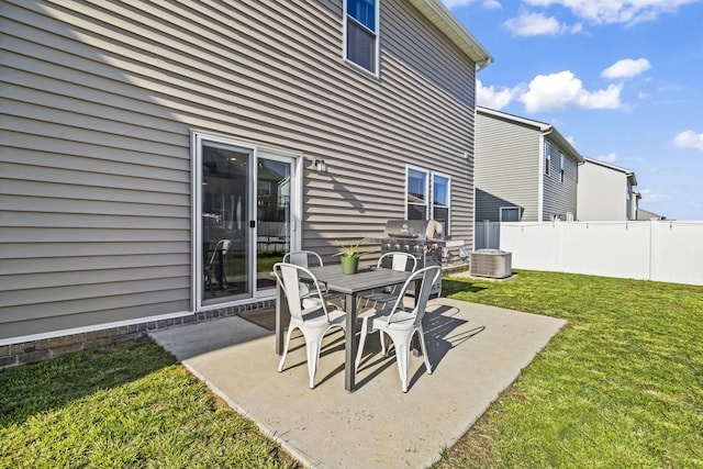 view of patio featuring central AC unit, grilling area, and outdoor dining area