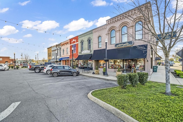 view of commercial property with uncovered parking