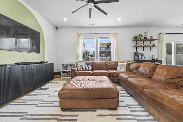 living room with a ceiling fan and recessed lighting