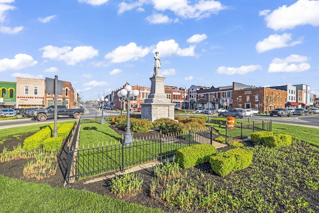view of community with fence