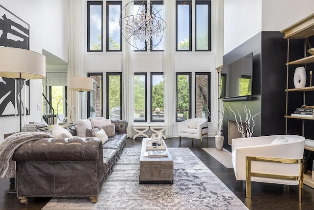 716 Split Rail Dr, Brentwood, TN 37027 - living area with a towering ceiling, plenty of natural light, wood finished floors, and a chandelier