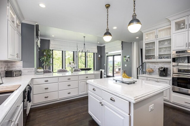 716 Split Rail Dr, Brentwood, TN 37027 - kitchen with decorative backsplash, ornamental molding, recessed lighting, dark wood-style floors, and a center island