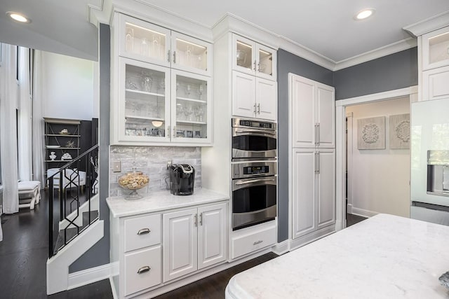 716 Split Rail Dr, Brentwood, TN 37027 - kitchen featuring white cabinets, recessed lighting, tasteful backsplash, ornamental molding, and glass insert cabinets