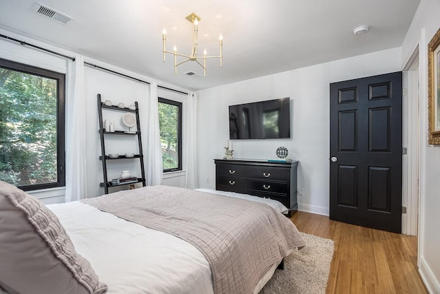 716 Split Rail Dr, Brentwood, TN 37027 - bedroom with light wood-style flooring, a chandelier, and baseboards