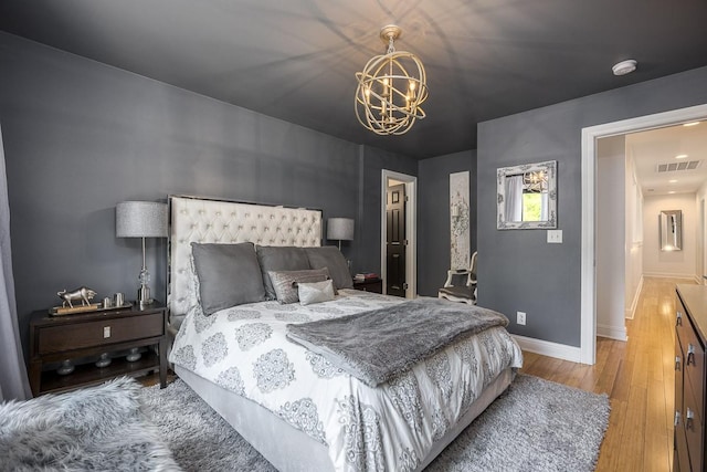 716 Split Rail Dr, Brentwood, TN 37027 - bedroom with a chandelier, light wood-style floors, and baseboards