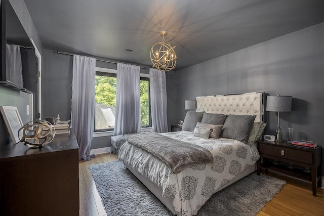 716 Split Rail Dr, Brentwood, TN 37027 - bedroom with a chandelier and light wood-style flooring
