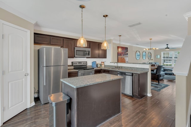 127 Cobblestone Place Dr, Goodlettsville, TN 37072 - kitchen with stainless steel appliances, dark brown cabinets, dark wood-style floors, a peninsula, and a sink